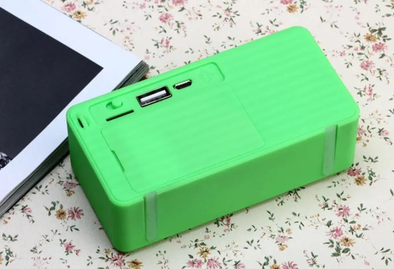 Cannon X3 small cube-shaped portable Bluetooth speaker in black, blue, green, red, and yellow colour options