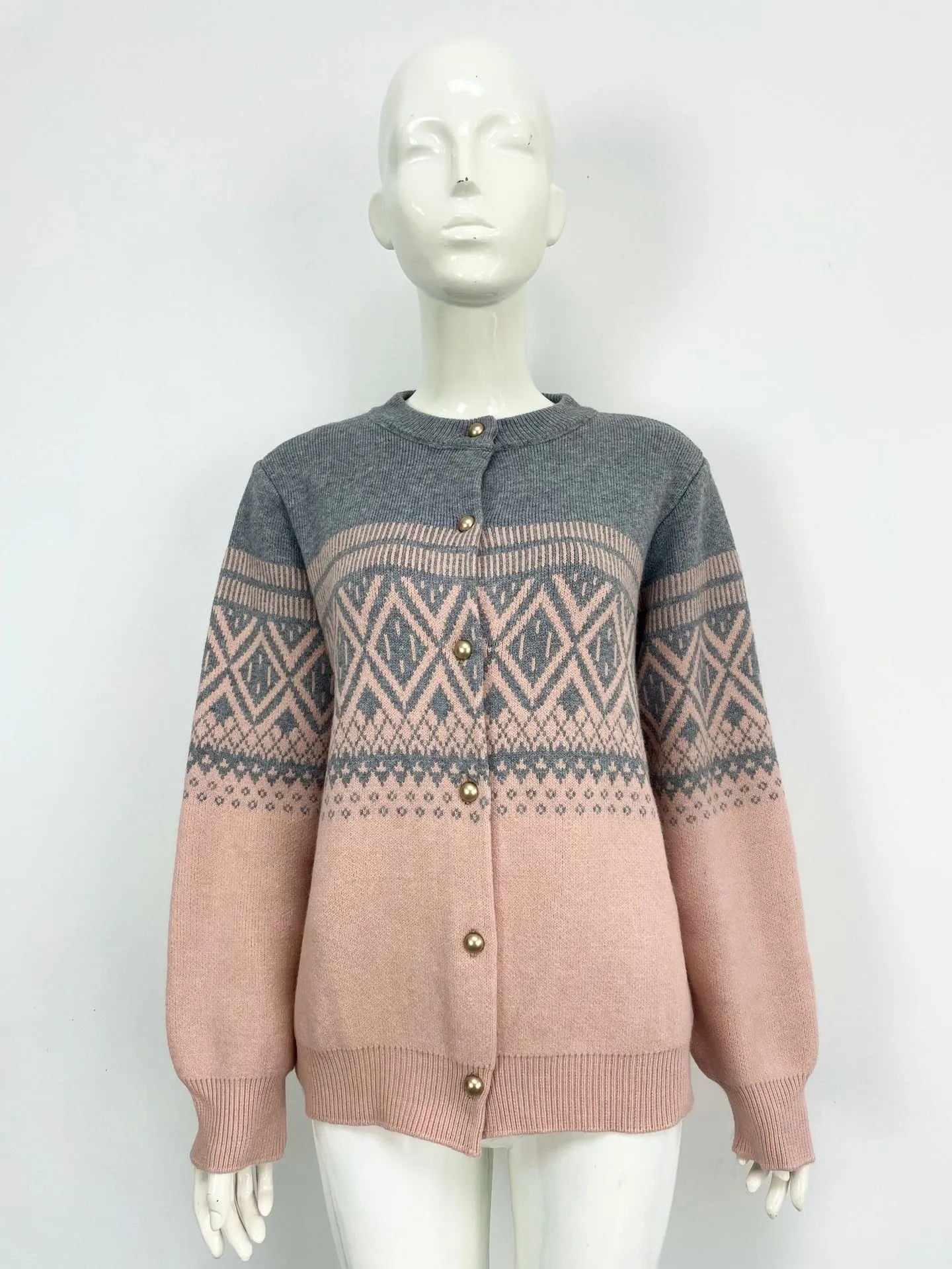 Women's grey alpaca wool cardigan with long sleeves and a diamond knit pattern in contrasting colours.