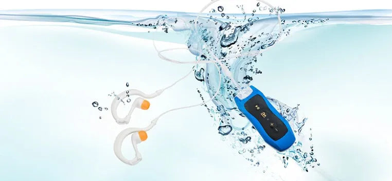 Compact black Bluetooth MP3 headset with IPX68 waterproof rating for swimming and running.