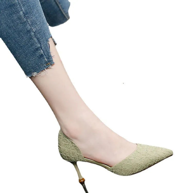 Women's black pointed-toe stiletto high heels with PU leather upper and thin heel.