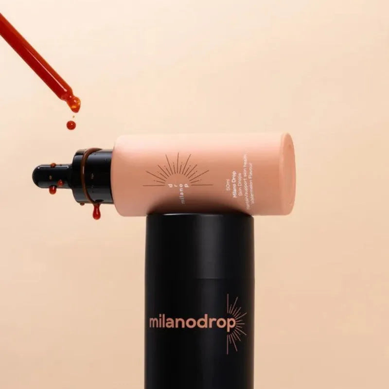 Matte black sun tanning liquid drops bottle and tanning flash cream tube set for a gradual tan.