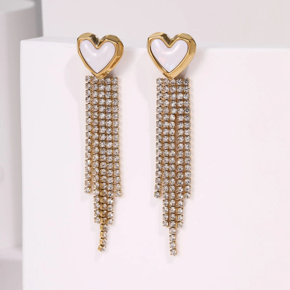 Stainless steel earrings with diamond tassel and heart shapes in 18K gold electroplated finish