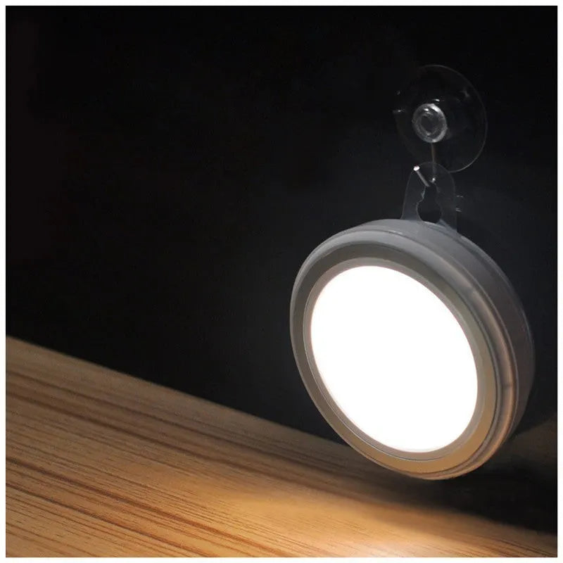 Compact circular motion sensor LED light with PIR sensor, 80mm diameter, for wardrobe and corridor lighting.