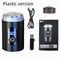 Black mini USB rechargeable shaver with cleaning brush and cable on white background