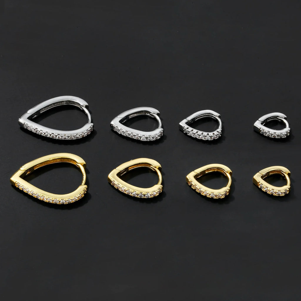 Geometric heart-shaped copper clip-on earring with gold electroplated finish.