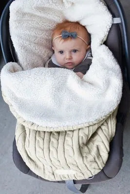 Envelope-style baby stroller sleeping bag in beige colour showing thick cotton wool filling and soft lining.