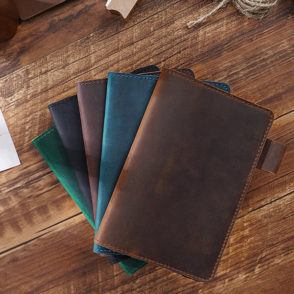 Handmade old-fashioned kraft notebook with cowhide cover, open to show wood-free paper pages.