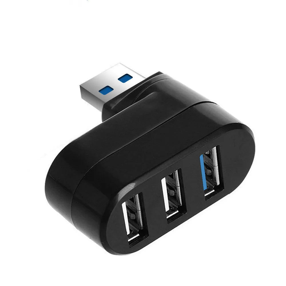 Black and white USB 3.0 hub with four ports and a rotating design on a desk.