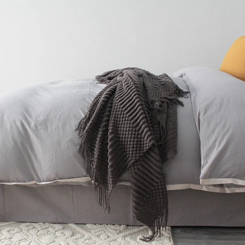 Small polyester nap blanket in dark grey, khaki, or light grey colours showing 127x170cm dimensions