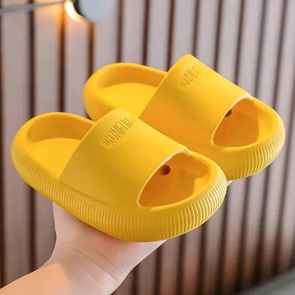 Children's mixed colour EVA slippers with non-slip soles showing 1.5cm thickness