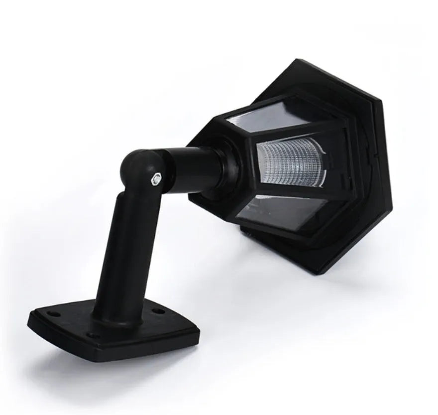 Black hexagonal solar-powered LED wall light for outdoor garden and security lighting