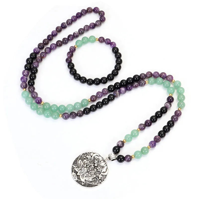 Yoga lotus pendant necklace and bracelet set with stone beads and geometric alloy pendant on adjustable chain.