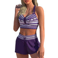 Women's two-piece print bikini swimsuit in polyester fabric shown in S M L XL sizes.