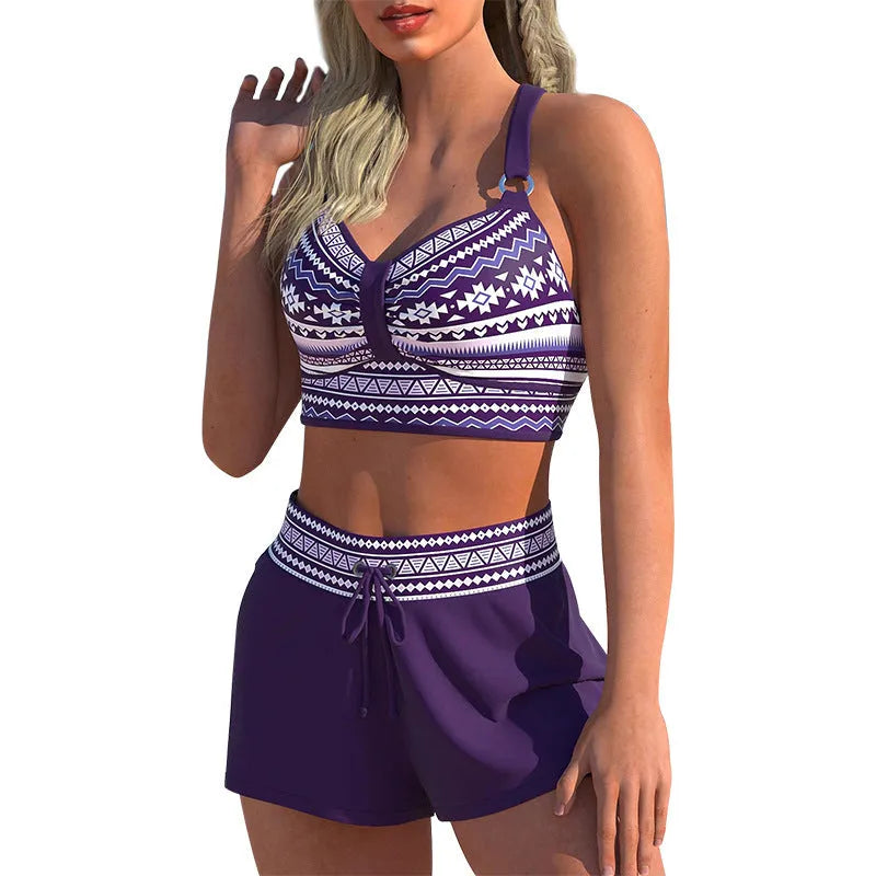 Women's two-piece print bikini swimsuit in polyester fabric shown in S M L XL sizes.