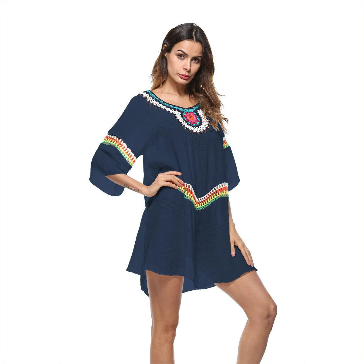 Crocheted ethnic-style beach cover-up for women in apricot colour, made from acrylic fabric.