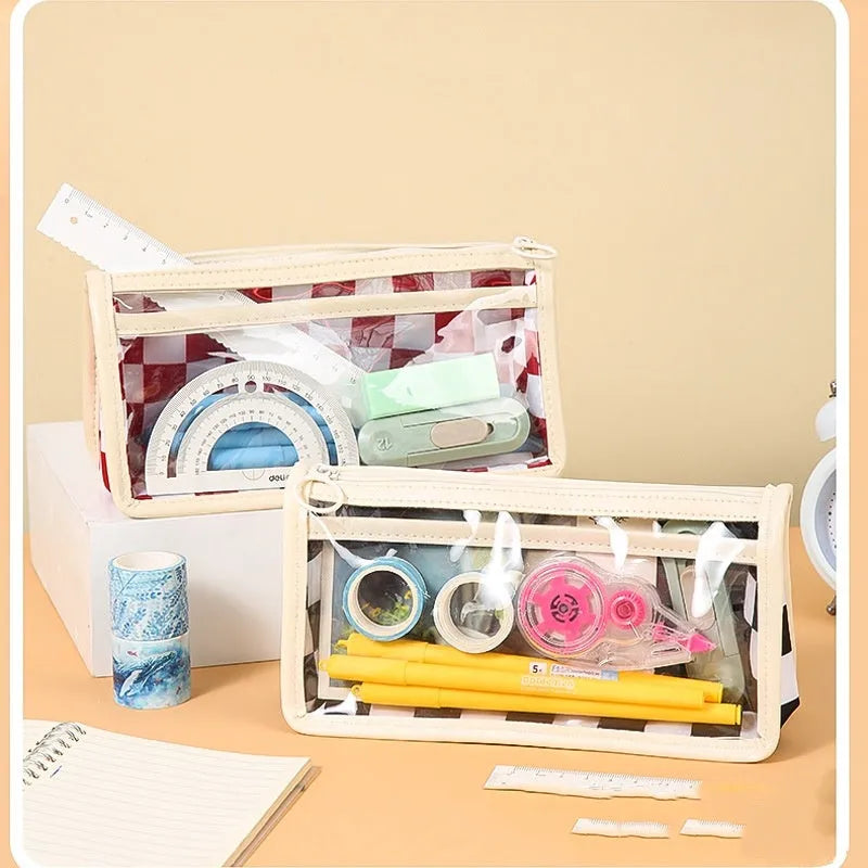 Transparent chessboard pattern PVC pencil case showing pens inside, black and white grid design