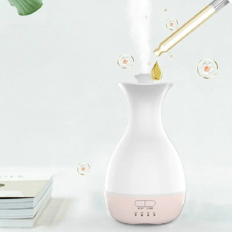 White ultrasonic humidifier and essential oil diffuser with colourful night light and 200ml water capacity