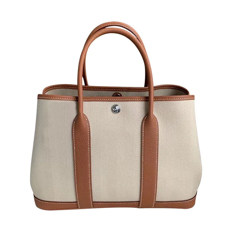 Women's canvas bucket tote bag with genuine leather details in 25cm and 30cm sizes