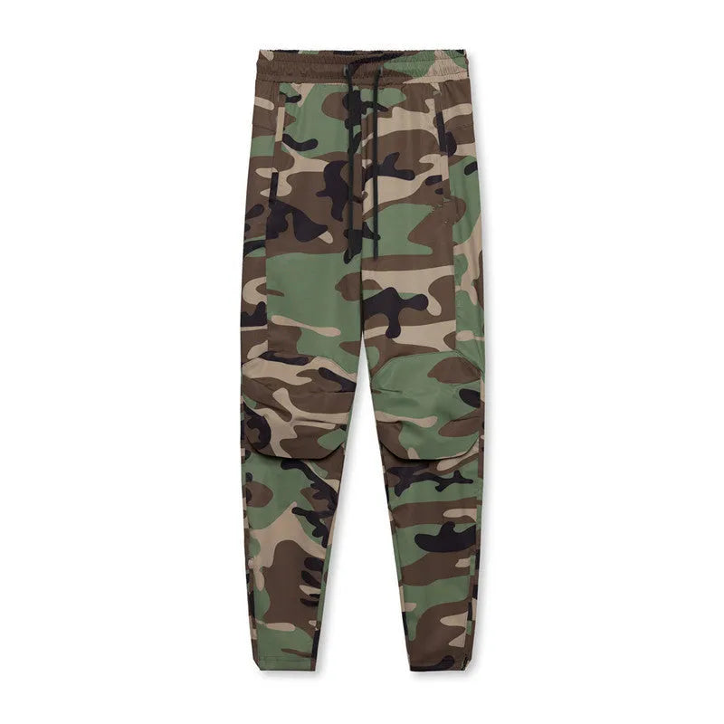 Man wearing loose grey ankle-tie fitness trousers suitable for running and gym workouts.