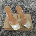 Women's black and silver high-heel fashion boots with a PVC sole on a white background.