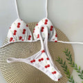 Women's printed bikini swimsuit set on a hanger, showing quick-dry fabric and cotton-lined briefs.