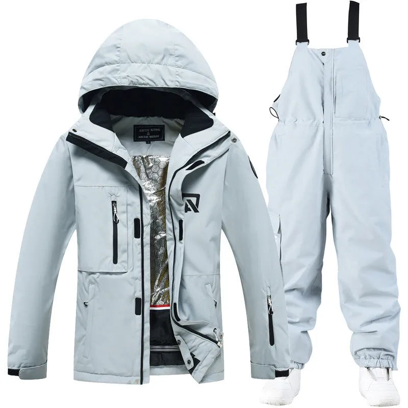 Men's and women's waterproof ski suit in blue with black trousers for winter snow sports