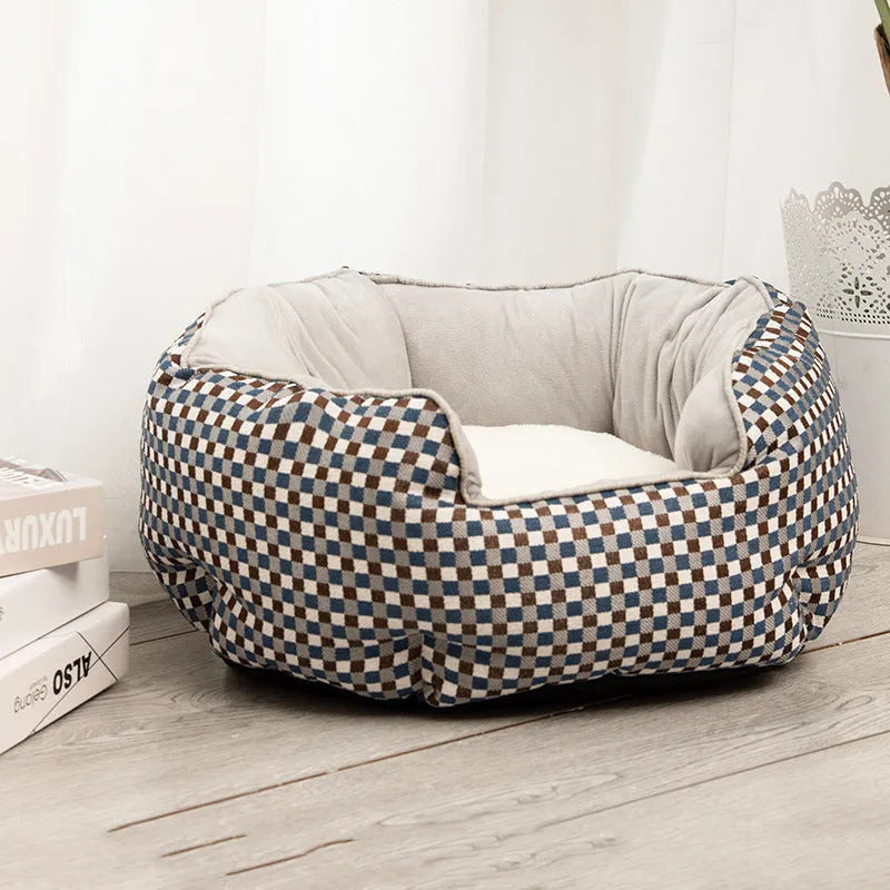 Octagonal grey pet bed with soft padded rim and removable inner mat for a small dog