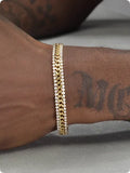 Gold plated tennis bracelet with stone inlay details on titanium steel base for unisex wear