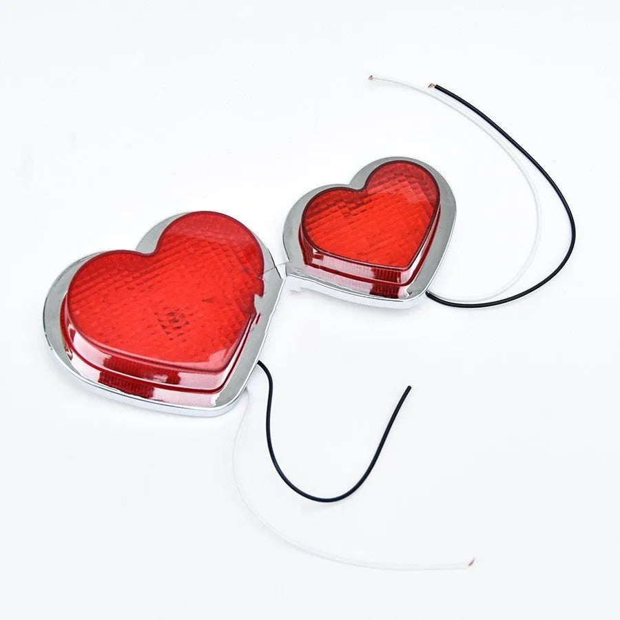 Heart-shaped red LED sidelight for car or motorcycle fender in large size.