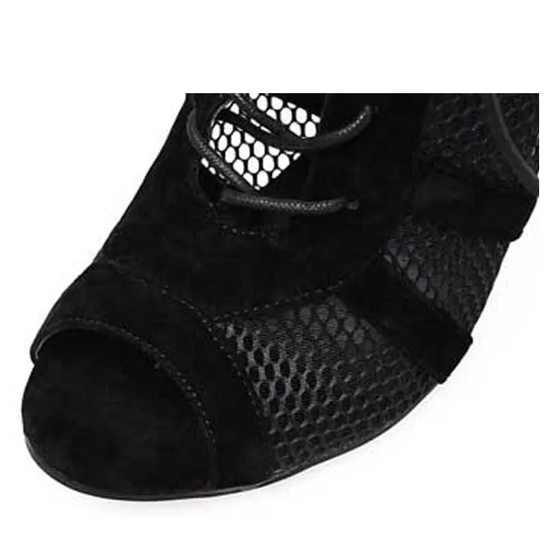 Black suede women's lace-up high heel shoes with a tall heel on a white background.