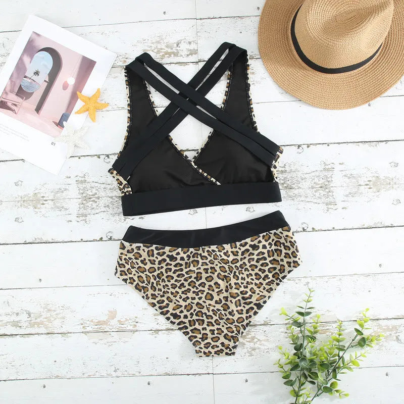 Women's leopard print bikini swimsuit with cross band back and V-neck design shown in white and pattern options