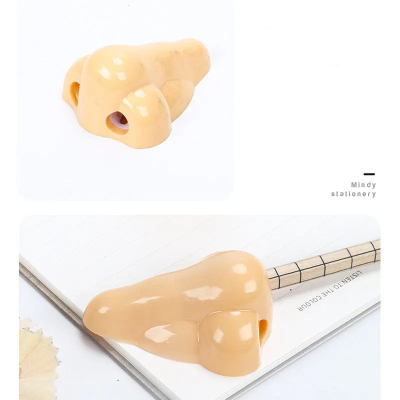 Flesh coloured plastic manual pencil sharpener with a geometry shape and large nostril opening.