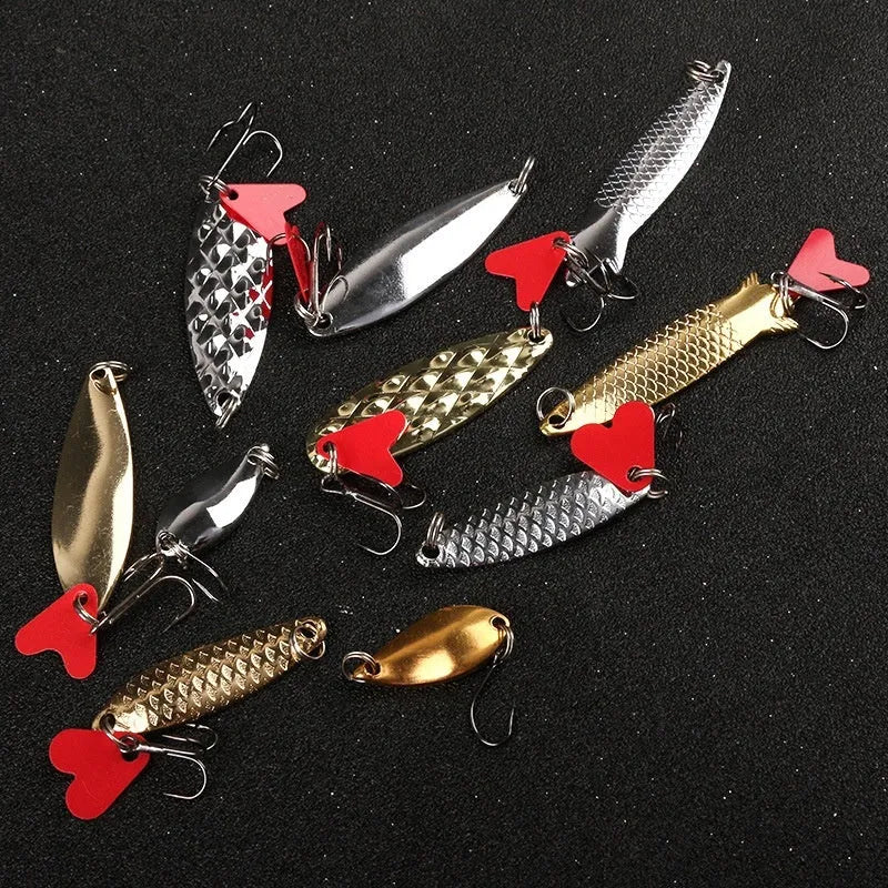 Box of gold and silver metal sequin false bait bodies for fishing lure repair and customisation.