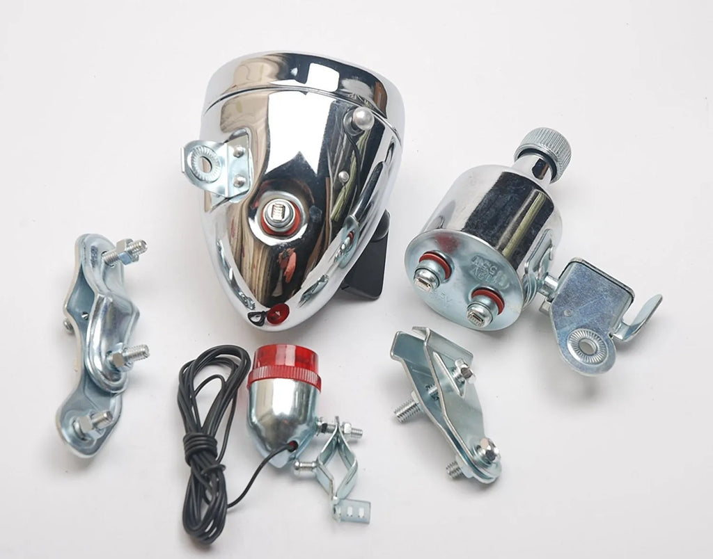 Silver bicycle dynamo-powered light generator kit for front fork or rear frame mounting.