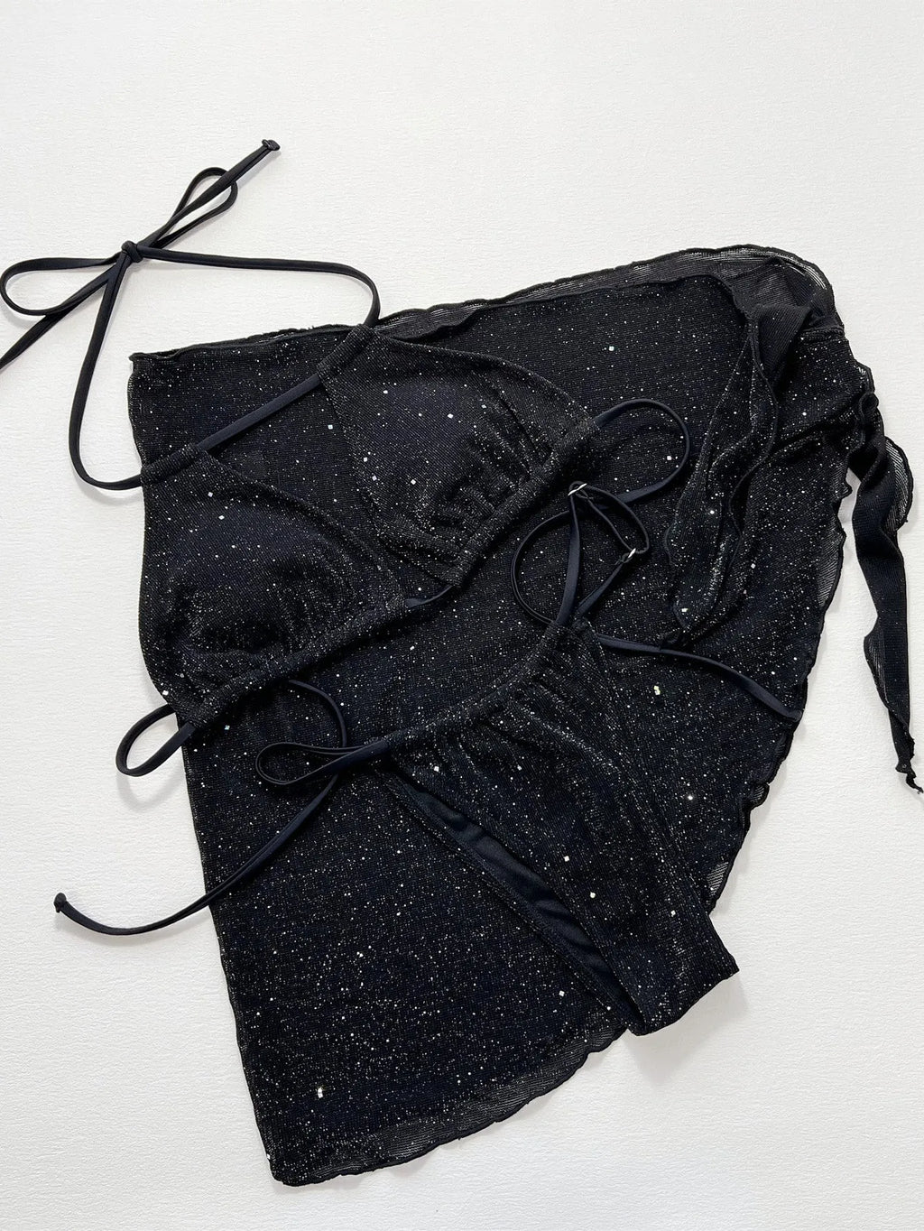 Black three-piece bikini swimsuit set with top and shorts in polyester fibre fabric