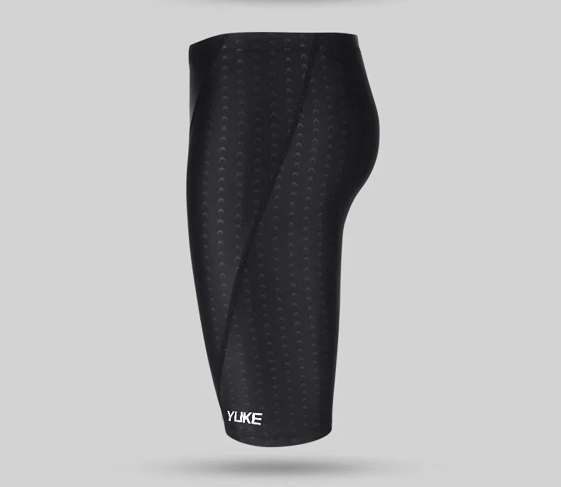 Men's black swimming set with briefs trunks, anti-fog goggles, waterproof cap, ear plugs, nose clip, and carry bag.