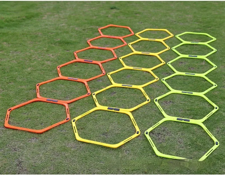Set of six foldable hexagon football agility training rings in yellow, green and orange colours