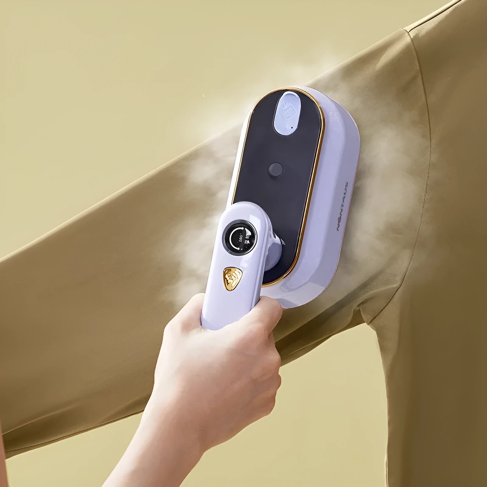 Light purple foldable portable travel iron with a ceramic soleplate on a white background.