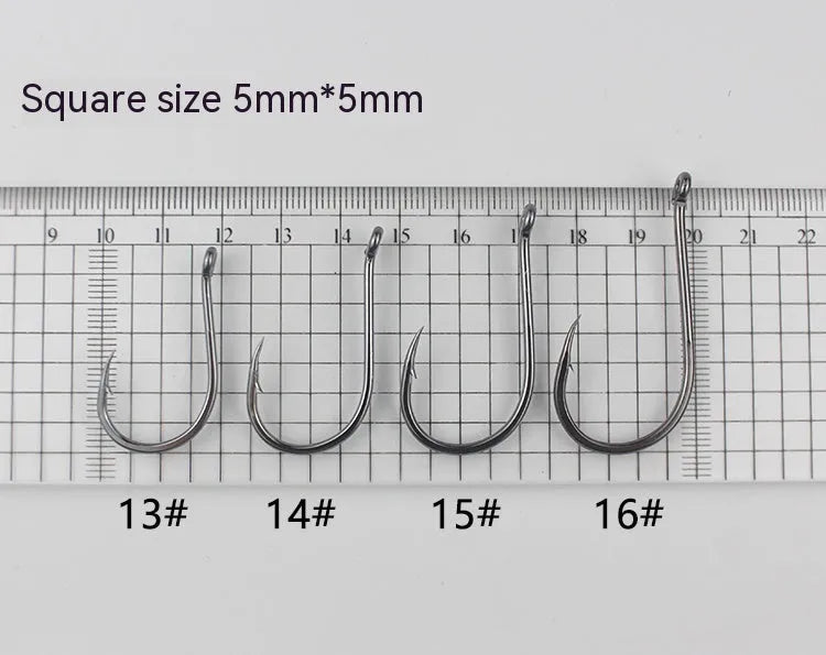 Bulk pack of barbed alloy carbon steel sea fishing hooks with a crooked mouth and hole ring design.