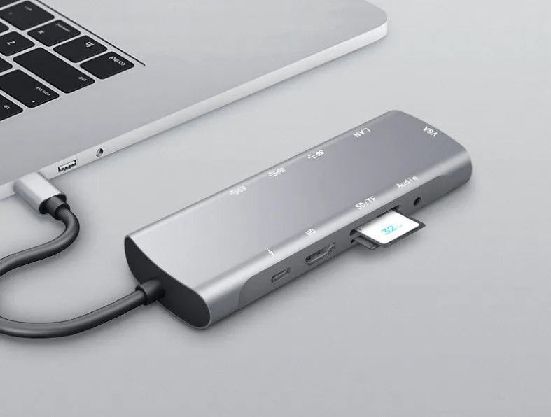 Grey USB C docking station with HDMI, VGA, and USB 3.0 ports for laptop connectivity