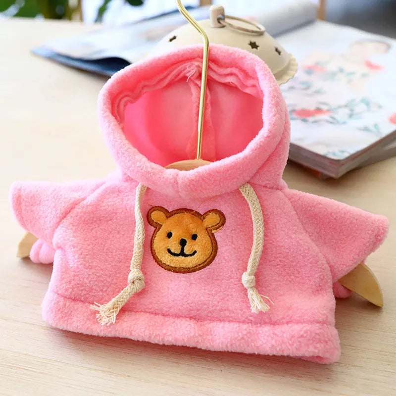 Dog wearing a cloth balaclava hoodie sweater available in blue, pink, red, yellow, brown, or grey bear design