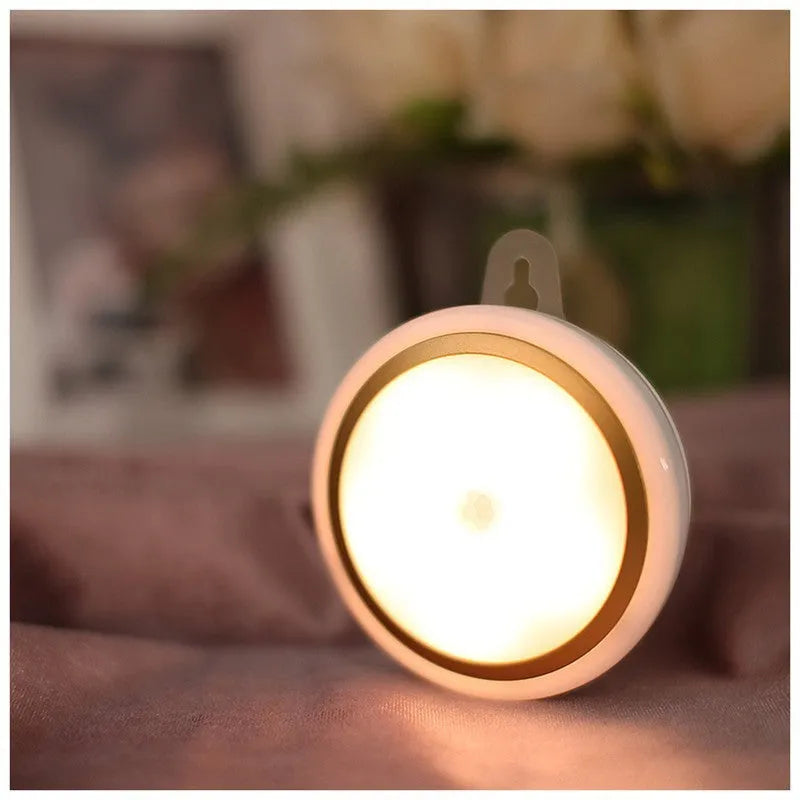 Compact circular motion sensor LED light with PIR sensor, 80mm diameter, for wardrobe and corridor lighting.