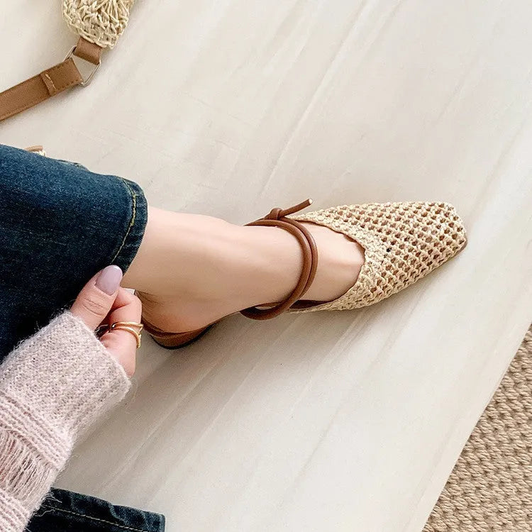 Women's black French-style square toe slippers with hollow-out design and a chunky mid-heel on a rubber sole.