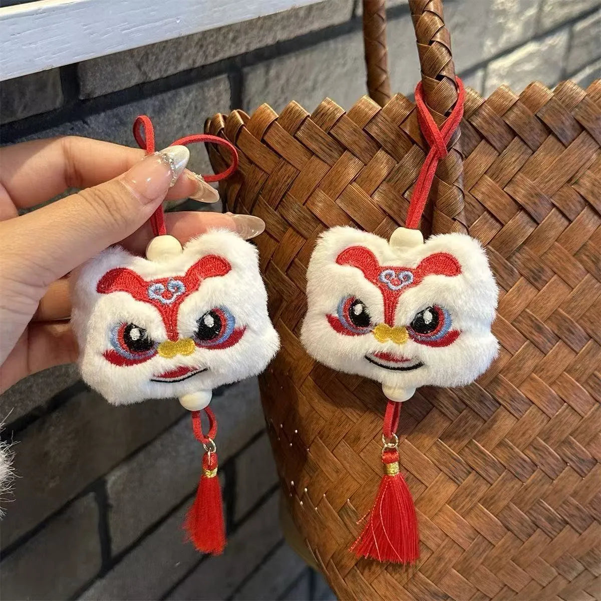 Blue and yellow handmade plush cartoon lion keychain with long tassel and star stone decoration.