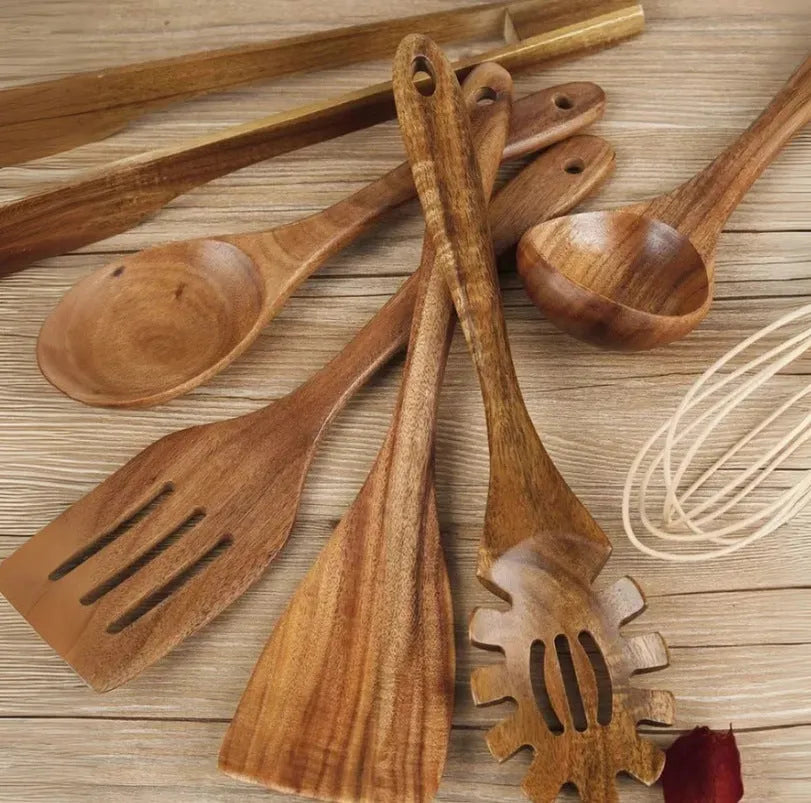 7-piece wooden cooking utensil set with natural wood finish including various spoon and spatula designs