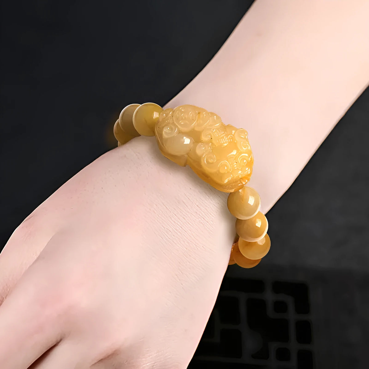 Carved jinsi jade money bracelet in golden thread colour with detailed bead sizing