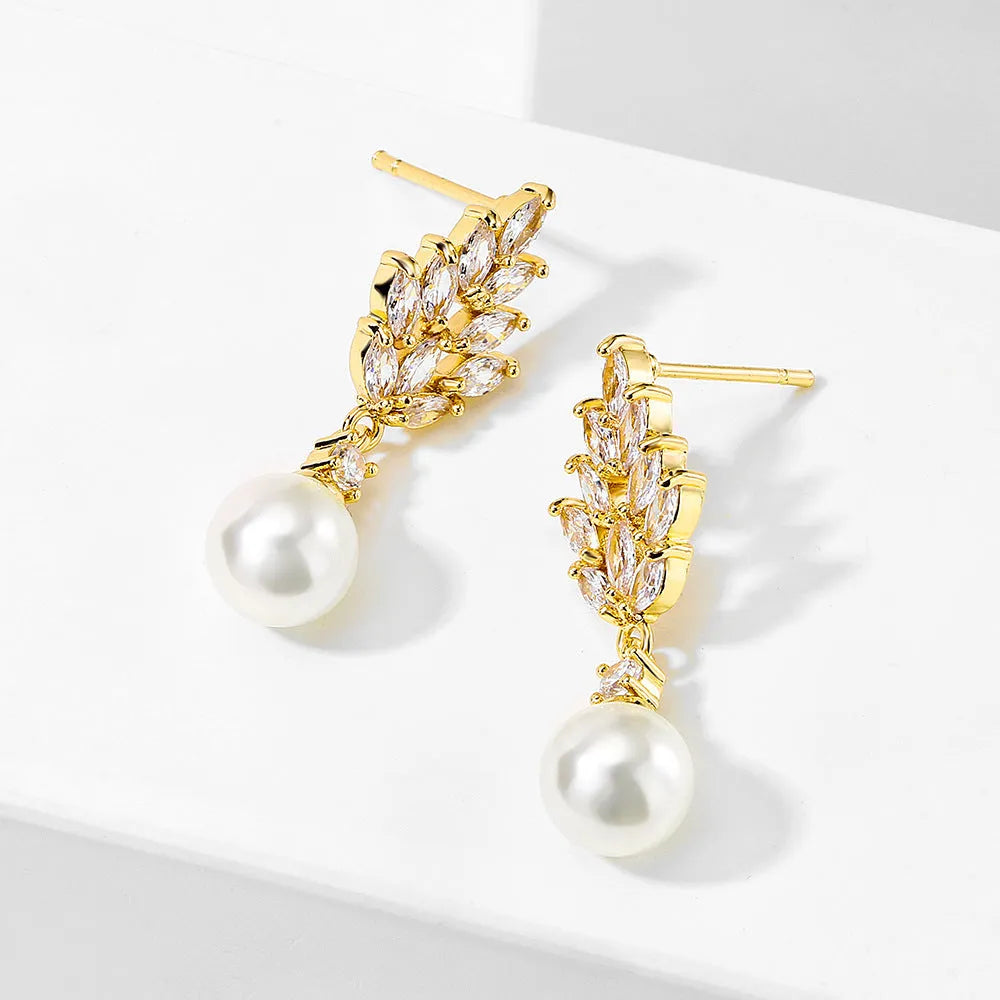 Geometric drop earrings with pearl and micro inlaid zircon, available in gold, platinum, and rose gold plating.