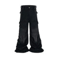 Teenager wearing black detachable washed-out cotton overalls with multiple pockets.