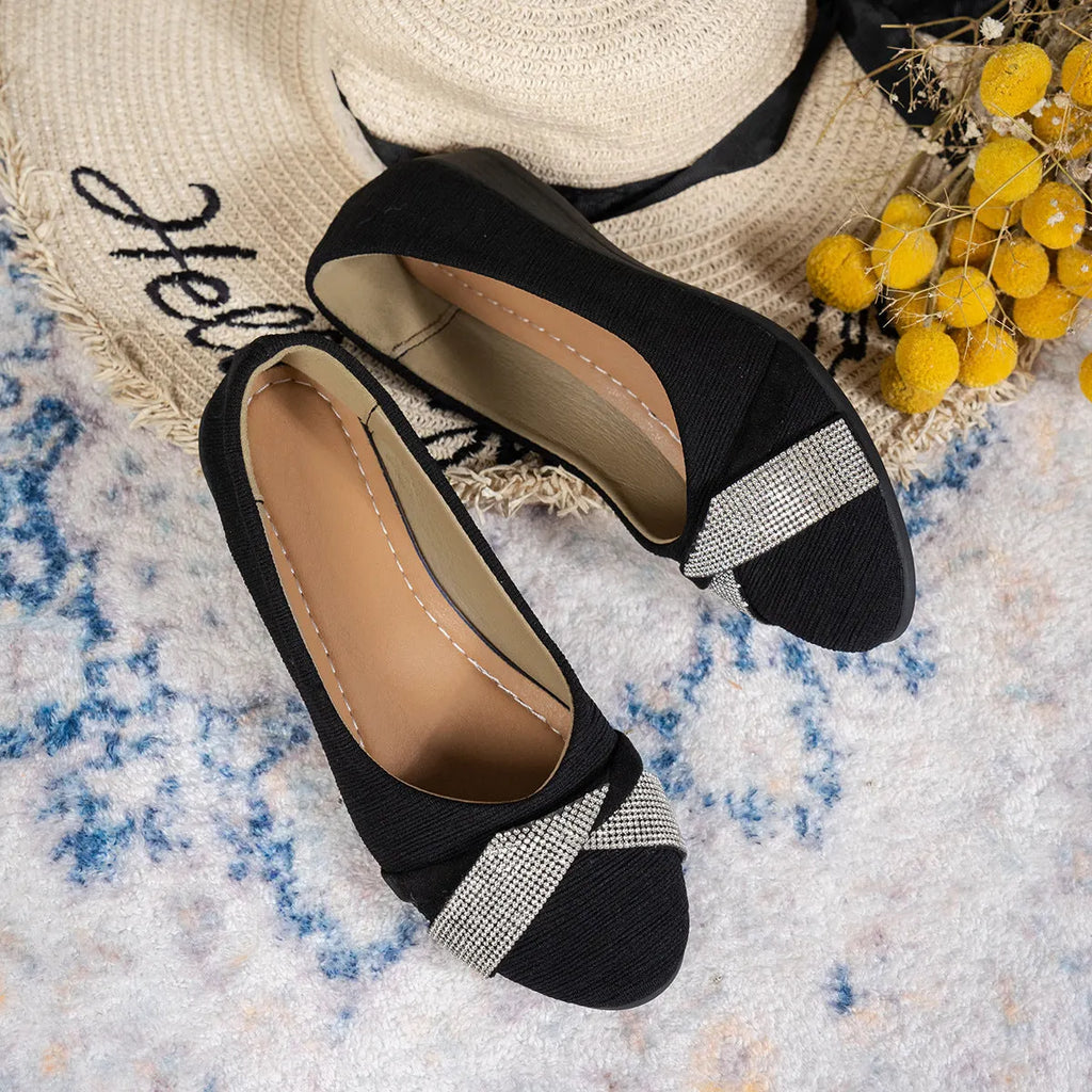 Black women's slip-on casual shoes with rhinestone detail and a chunky heel.