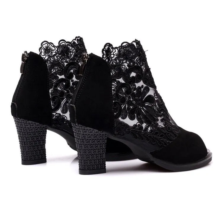Black women's gladiator sandals with flower lace pattern and square heel on rubber outsole